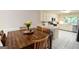 Bright eat-in kitchen features white cabinetry, stainless appliances and large window view at 170 River Forest Dr, Fayetteville, GA 30214