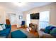 Open living room features hardwood floors, comfortable seating and bright natural light at 170 River Forest Dr, Fayetteville, GA 30214