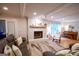 Bright living area with a stone fireplace, plush seating, and a charming piano ideal for entertaining guests at 170 River Forest Dr, Fayetteville, GA 30214