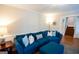 Cozy living room with bright natural light and plush blue sofa at 170 River Forest Dr, Fayetteville, GA 30214