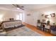 Main bedroom with ceiling fan, hardwood floors, rug and multiple storage spaces at 170 River Forest Dr, Fayetteville, GA 30214