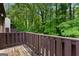 Private balcony overlooking the wooded backyard, a quiet and relaxing space at 53 Cobblestone Crk, Peachtree City, GA 30269