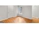 Bright bedroom featuring a window and beautiful hardwood flooring at 53 Cobblestone Crk, Peachtree City, GA 30269
