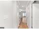 Bright hallway with hardwood floors leading to a living room and outdoor deck at 53 Cobblestone Crk, Peachtree City, GA 30269