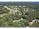 Aerial view shows the home's proximity to a golf course, and the neighborhood in a serene, wooded neighborhood at 20 Allie Dr, Mcdonough, GA 30252