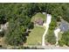 Stunning aerial view of a beautiful home nestled among lush trees, featuring a spacious lot at 20 Allie Dr, Mcdonough, GA 30252