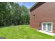 Large, well-maintained backyard featuring lush green grass and mature trees, perfect for outdoor activities at 20 Allie Dr, Mcdonough, GA 30252