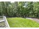 Expansive backyard featuring a lush lawn, surrounded by mature trees and a charming gazebo at 20 Allie Dr, Mcdonough, GA 30252