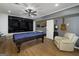Finished basement with a pool table, sleek TV, and guitars, perfect for entertainment at 20 Allie Dr, Mcdonough, GA 30252