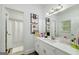 Charming bathroom features vanity with sink, framed mirror, and shower with a curtain at 20 Allie Dr, Mcdonough, GA 30252