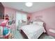 Pink bedroom with plush details, including decorative elements on the walls at 20 Allie Dr, Mcdonough, GA 30252