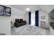 Upstairs bonus room with two recliners, window, and mini-fridge at 20 Allie Dr, Mcdonough, GA 30252