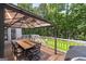 Outdoor deck with dining table and seating under a gazebo, perfect for entertaining at 20 Allie Dr, Mcdonough, GA 30252