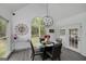 Dining area with modern chandelier, large window, and stylish decor at 20 Allie Dr, Mcdonough, GA 30252