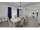 Elegant dining room featuring a large table with seating for six, chandelier, and hardwood floors at 20 Allie Dr, Mcdonough, GA 30252
