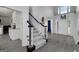 Elegant entryway with staircase, hardwood floors, and abundant natural light at 20 Allie Dr, Mcdonough, GA 30252