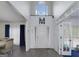 Inviting foyer with high ceilings, hardwood floors, and large windows that let in natural light at 20 Allie Dr, Mcdonough, GA 30252