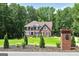 Charming two-story brick home with lush front yard and landscaping, set back from the road at 20 Allie Dr, Mcdonough, GA 30252