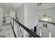 Second floor hallway with chandelier and view down to the foyer at 20 Allie Dr, Mcdonough, GA 30252