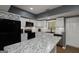 Kitchen with white cabinetry, modern appliances, and granite island, designed for cooking and entertaining at 20 Allie Dr, Mcdonough, GA 30252