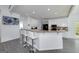 Bright kitchen boasts granite countertops, stainless steel appliances, breakfast bar, and pendant lighting at 20 Allie Dr, Mcdonough, GA 30252