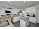 Well-lit kitchen featuring granite countertops, stainless steel appliances, and white cabinetry at 20 Allie Dr, Mcdonough, GA 30252