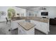 Bright, open kitchen with white cabinets, granite counters, and stainless steel appliances at 20 Allie Dr, Mcdonough, GA 30252