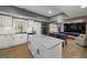 Open-concept space featuring kitchen island with granite counters, and entertaining area with game tables at 20 Allie Dr, Mcdonough, GA 30252