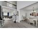 Open-concept living space showcasing hardwood floors, staircase, and views into the dining and living rooms at 20 Allie Dr, Mcdonough, GA 30252