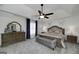 Main bedroom features carpet, ceiling fan, and dark wood furniture at 20 Allie Dr, Mcdonough, GA 30252