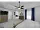 This main bedroom features a ceiling fan, en-suite bathroom, and TV at 20 Allie Dr, Mcdonough, GA 30252