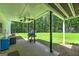Covered patio featuring ceiling fans, a grill, and backyard views overlooking the lawn and gazebo at 20 Allie Dr, Mcdonough, GA 30252