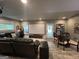 Finished basement featuring a media center, large sectional sofa and room to entertain at 1122 Montclair Dr, Peachtree City, GA 30269