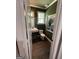 Stylish half bathroom featuring hardwood floors and elegant accents at 1122 Montclair Dr, Peachtree City, GA 30269