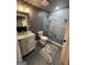 Bathroom featuring a modern vanity and tiled stand up shower with glass door at 1122 Montclair Dr, Peachtree City, GA 30269