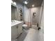 This clean bathroom features neutral decor, a shower/tub combination, and a vanity sink at 1122 Montclair Dr, Peachtree City, GA 30269