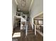 Grand foyer with a staircase and views into the living and dining rooms at 1122 Montclair Dr, Peachtree City, GA 30269