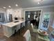 Open kitchen with a breakfast bar overlooking the living room at 1122 Montclair Dr, Peachtree City, GA 30269