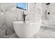 Beautiful bathroom with a standalone tub, luxurious shower, and stunning marble tile at 2018 Presley, Atlanta, GA 30317
