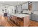 Modern kitchen island with a white countertop, wine rack, and seating for a perfect gathering space at 2018 Presley, Atlanta, GA 30317