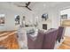 Bright living room with hardwood floors, a ceiling fan, and a fireplace with a wooden mantle at 2018 Presley, Atlanta, GA 30317