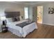 Comfortable bedroom with ensuite bathroom, side table, and a large window offering natural light at 219 Maple Creek Chase, Woodstock, GA 30188