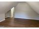 Slanted bedroom featuring wood floors at 219 Maple Creek Chase, Woodstock, GA 30188