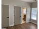 A bedroom showcases access to an ensuite bathroom, wood-style floors, neutral paint, and trim at 219 Maple Creek Chase, Woodstock, GA 30188