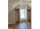 This bedroom features wood floors and closet space at 219 Maple Creek Chase, Woodstock, GA 30188