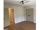 This large bedroom features a closet and adjoining room perfect for storage at 219 Maple Creek Chase, Woodstock, GA 30188
