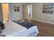 Well-lit bedroom showcases wood floors and art pieces that enhances the overall appeal of the room at 219 Maple Creek Chase, Woodstock, GA 30188