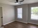 This bedroom features hardwood floors and a modern ceiling fan for added comfort at 219 Maple Creek Chase, Woodstock, GA 30188
