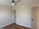 Empty bedroom featuring wood-style floors, neutral paint, and trim, with two entrances at 219 Maple Creek Chase, Woodstock, GA 30188