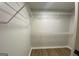 Walk-in closet featuring ample shelving for organized storage solutions at 219 Maple Creek Chase, Woodstock, GA 30188